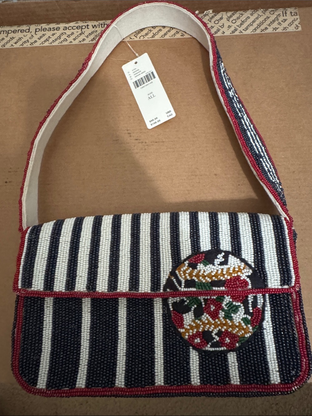 Beaded bag with floral baseball design